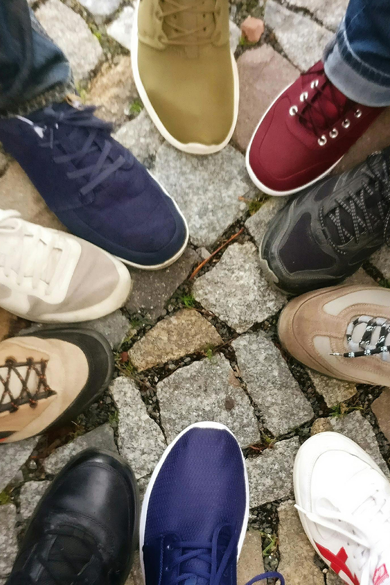 Photo by Ingo Joseph from Pexels: https://www.pexels.com/photo/people-forming-round-by-shoes-609771/